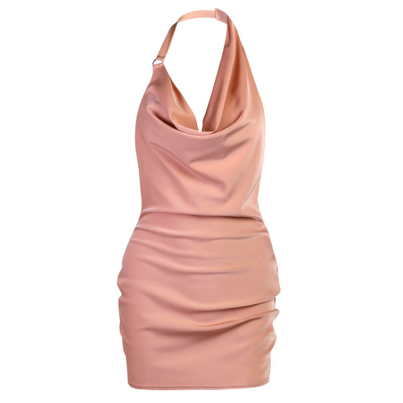 Pink halter neck dress on a white background